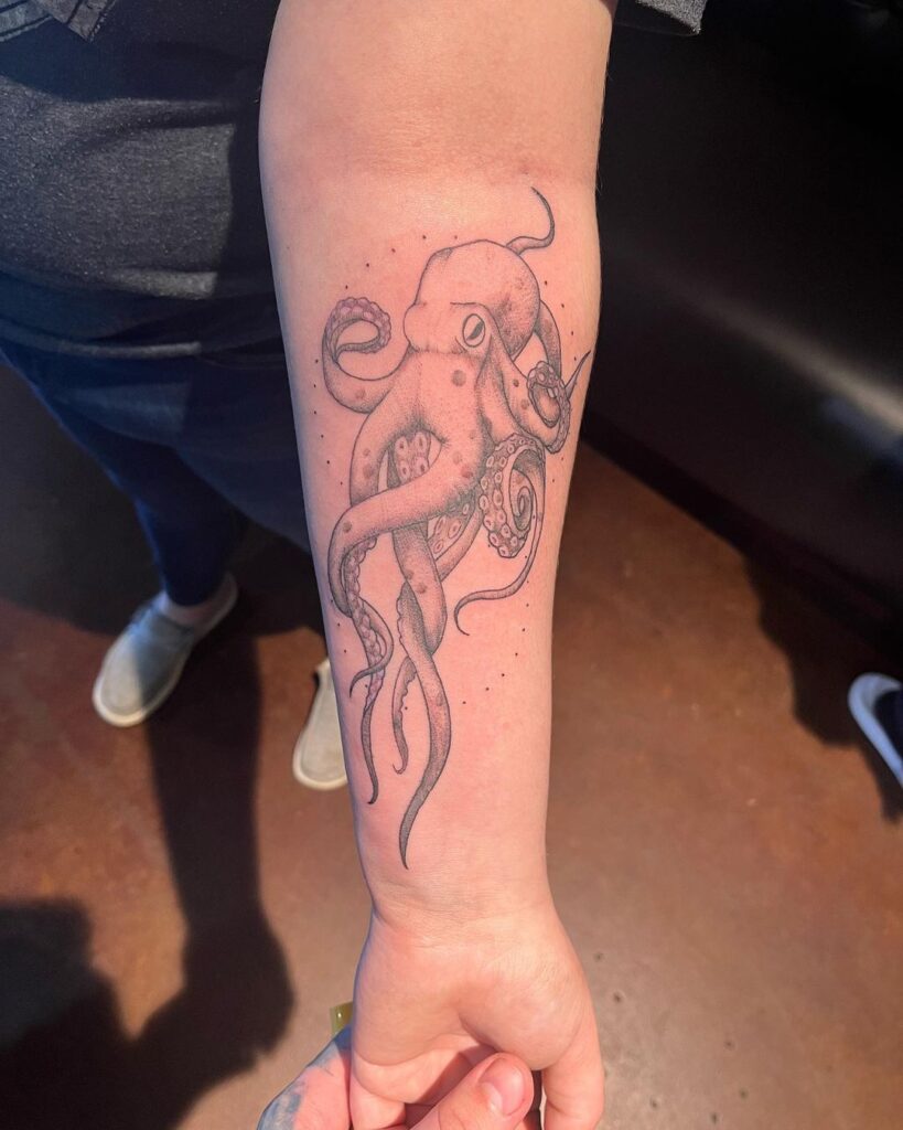 Onderarm octopus tattoo